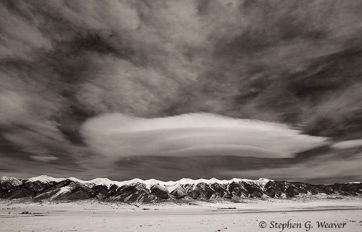 A lenticular cloud hovers over the northern Sangre de Cristo Range, Colorado