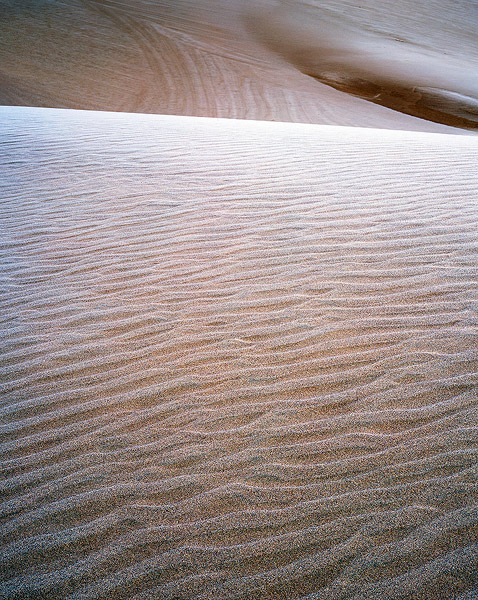 Frost accents the ripples on the dunes on a cold Winter morning at Great Sand Dunes National Park. Colorado