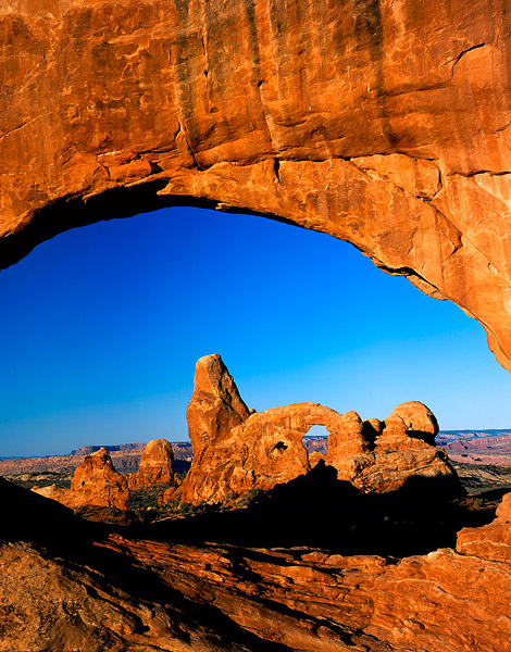 Early morning lights Turret Arch and North Window in Arches National Park