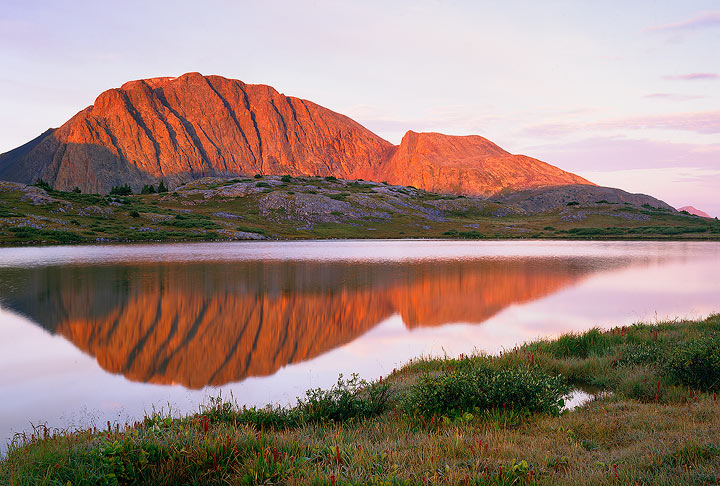 Peak Two of the Grenadier Range reflects in an unnamed tarn in the Weminche Wilderness, Colorado